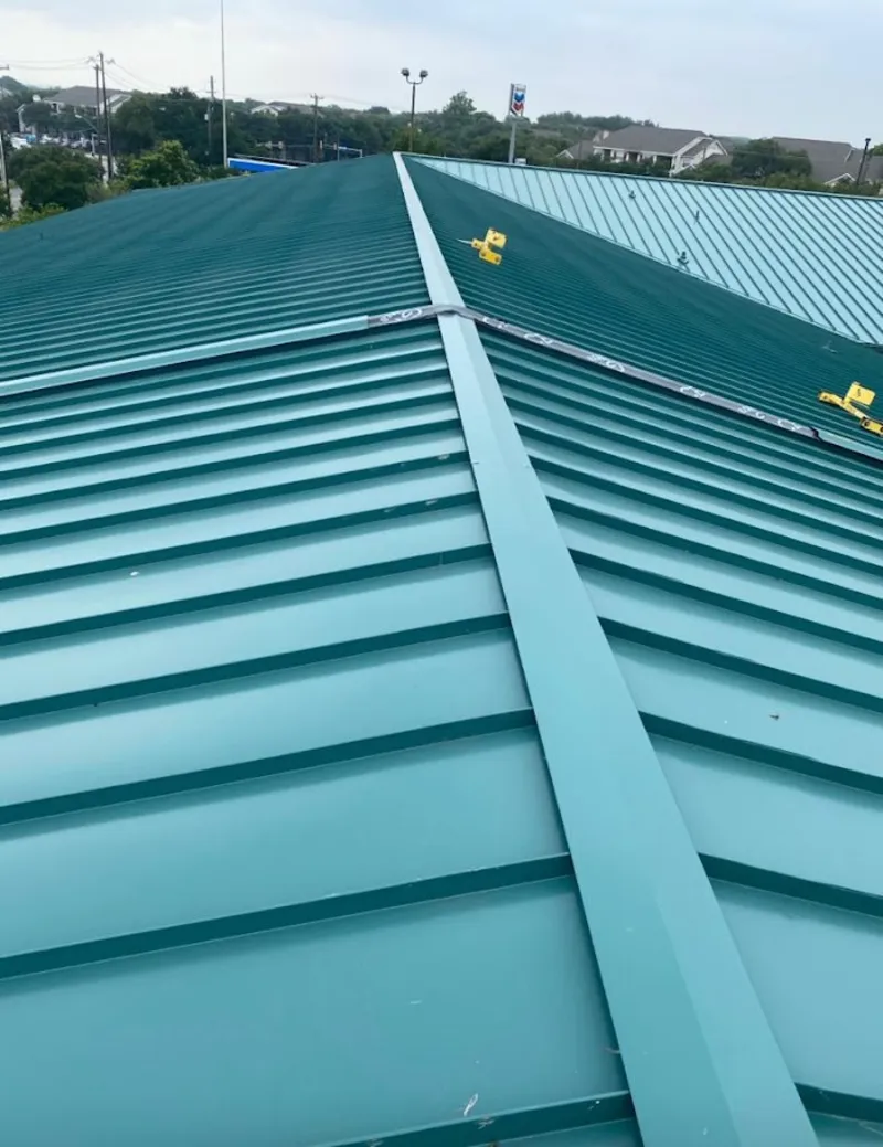 Green commercial metal roof ridge and valley for Metal Roof Repair in Mission Bend